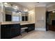 Bathroom with double vanity, dark cabinets, a large mirror, and great lighting at 1984 Mendenhall Cir, Atlanta, GA 30341