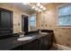 Bathroom with dual sinks, granite countertop, and ample lighting at 1984 Mendenhall Cir, Atlanta, GA 30341