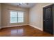 Bedroom with hardwood floors, natural light, and modern trim at 1984 Mendenhall Cir, Atlanta, GA 30341