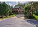 Charming two-story brick and stone home with lush landscaping and an attached two-car garage at 1984 Mendenhall Cir, Atlanta, GA 30341
