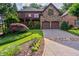 Beautiful two-story brick home featuring a stone facade and an attached two-car garage at 1984 Mendenhall Cir, Atlanta, GA 30341