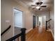 Hallway features hardwood floors and classic trimwork leading to other rooms at 1984 Mendenhall Cir, Atlanta, GA 30341