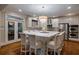 Gourmet kitchen featuring stainless steel appliances, an island with bar seating, and ample cabinet space at 1984 Mendenhall Cir, Atlanta, GA 30341