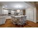 Bright kitchen features white cabinetry, granite counters, a large island with seating, and stainless steel appliances at 1984 Mendenhall Cir, Atlanta, GA 30341