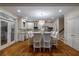 Open kitchen with a large island, granite countertops, stainless steel appliances, and hardwood floors at 1984 Mendenhall Cir, Atlanta, GA 30341
