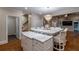 Spacious kitchen featuring a large island with bar seating and granite countertops at 1984 Mendenhall Cir, Atlanta, GA 30341