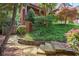 Beautifully landscaped front yard with stone steps and mature trees at 1984 Mendenhall Cir, Atlanta, GA 30341