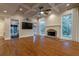 Spacious living room with hardwood floors, fireplace, coffered ceiling, and plenty of natural light at 1984 Mendenhall Cir, Atlanta, GA 30341