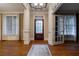 Bright living room featuring hardwood floors, large windows with white trim, and elegant columns at 1984 Mendenhall Cir, Atlanta, GA 30341