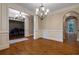 Spacious living room with hardwood floors, decorative pillars, and views into other rooms at 1984 Mendenhall Cir, Atlanta, GA 30341