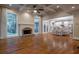 Open-concept living room with hardwood floors, fireplace, and seamless flow into kitchen at 1984 Mendenhall Cir, Atlanta, GA 30341
