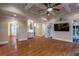 Open-concept living room featuring hardwood floors, coffered ceiling, and seamless flow to other living spaces at 1984 Mendenhall Cir, Atlanta, GA 30341