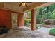Relaxing brick patio with lush landscaping, brick columns and a charming outdoor space with an American flag at 1984 Mendenhall Cir, Atlanta, GA 30341