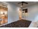 Charming sunroom featuring brick walls, a patterned rug, and views into the kitchen at 1984 Mendenhall Cir, Atlanta, GA 30341