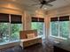Bright sunroom with large windows, bench seating, and decorative rug at 1984 Mendenhall Cir, Atlanta, GA 30341
