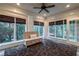 Bright sunroom with multiple windows, bench seating, and access to the outdoors at 1984 Mendenhall Cir, Atlanta, GA 30341