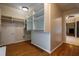 Spacious walk-in closet with custom storage solutions and hardwood floors at 1984 Mendenhall Cir, Atlanta, GA 30341