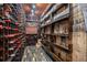 Well-stocked wine cellar featuring custom storage, wood accents, and a wide selection of wines at 1984 Mendenhall Cir, Atlanta, GA 30341