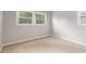 Empty bedroom featuring wall-to-wall carpet and natural light from windows at 340 Bell Se St, Marietta, GA 30060