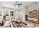 Bright living room featuring a ceiling fan, modern furniture, and natural light from large windows at 340 Bell Se St, Marietta, GA 30060