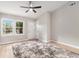 Bright living room featuring a ceiling fan and natural light from large windows at 340 Bell Se St, Marietta, GA 30060