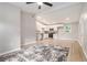 Bright, open-concept living area featuring wood floors, neutral walls, and seamless flow into modern, white-cabinet kitchen at 340 Bell Se St, Marietta, GA 30060
