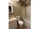 This bathroom has a toilet, sink, and shower combination with shower curtain at 645 Robin Rd, Covington, GA 30016