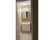 A bathroom with a sink, toilet and a mirror at 645 Robin Rd, Covington, GA 30016