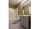 Bright bathroom features a modern vanity, mirror, updated fixtures, and a shower-tub combination at 645 Robin Rd, Covington, GA 30016