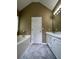 Bathroom featuring double-sink vanity, a large mirror, a bathtub, and tile flooring at 645 Robin Rd, Covington, GA 30016