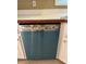 Close up of a turquoise dishwasher with stainless steel trim at 645 Robin Rd, Covington, GA 30016