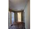 Hallway leading to bathroom, painted in neutral colors with white trim at 645 Robin Rd, Covington, GA 30016