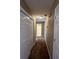 Long narrow hallway leading to a full bathroom at 645 Robin Rd, Covington, GA 30016