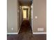 Hallway with carpet floors, neutral paint, and white trim at 645 Robin Rd, Covington, GA 30016