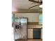 Spacious kitchen with stainless steel appliances and white cabinetry at 645 Robin Rd, Covington, GA 30016