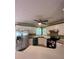 Spacious kitchen with stainless steel appliances, ample cabinet space, and a ceiling fan at 645 Robin Rd, Covington, GA 30016