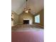 Inviting living room with a cozy fireplace and vaulted ceilings, creating a warm and open atmosphere at 645 Robin Rd, Covington, GA 30016
