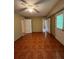 Open living room with tile floors, ceiling fan, and inviting entryways to other spaces at 645 Robin Rd, Covington, GA 30016
