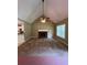 Spacious living room featuring a fireplace, large windows, and open access to the kitchen at 645 Robin Rd, Covington, GA 30016