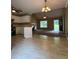 Open living room featuring tile floors, recessed lighting, and views of the front yard at 645 Robin Rd, Covington, GA 30016