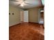 Bright living room with tile floors, a ceiling fan, and multiple doorways for seamless flow at 645 Robin Rd, Covington, GA 30016