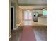 Open living space with a view into the bright kitchen and access to the outdoors through french doors at 645 Robin Rd, Covington, GA 30016