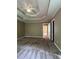 Spacious main bedroom with a tray ceiling, ceiling fan, and neutral carpeting at 645 Robin Rd, Covington, GA 30016