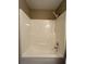 Close-up of a clean white shower and tub combination with chrome fixtures and a shower head at 645 Robin Rd, Covington, GA 30016