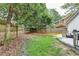 Large backyard with grass and privacy fence, with access to the back deck and yard at 1133 Capital Club Ne Cir, Brookhaven, GA 30319