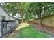 Spacious backyard with a well-maintained lawn and a deck that allows for outdoor enjoyment at 1133 Capital Club Ne Cir, Brookhaven, GA 30319