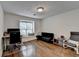 Bright room with hardwood floors and a large window offering natural light, complete with a desk and futon at 1133 Capital Club Ne Cir, Brookhaven, GA 30319
