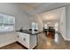Modern kitchen with white cabinets, stainless appliances, granite countertops and bar seating at 1133 Capital Club Ne Cir, Brookhaven, GA 30319