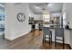 Modern kitchen with white cabinets, stainless steel appliances, and a breakfast bar with seating at 1133 Capital Club Ne Cir, Brookhaven, GA 30319