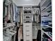 Organized walk-in closet features shelving units, rods, and drawers for ample storage space at 1133 Capital Club Ne Cir, Brookhaven, GA 30319